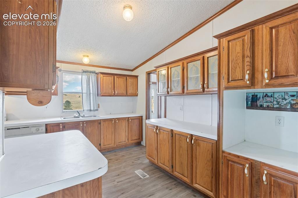 Image 11 of 24: Upgraded LVP flooring in the spacious kitchen