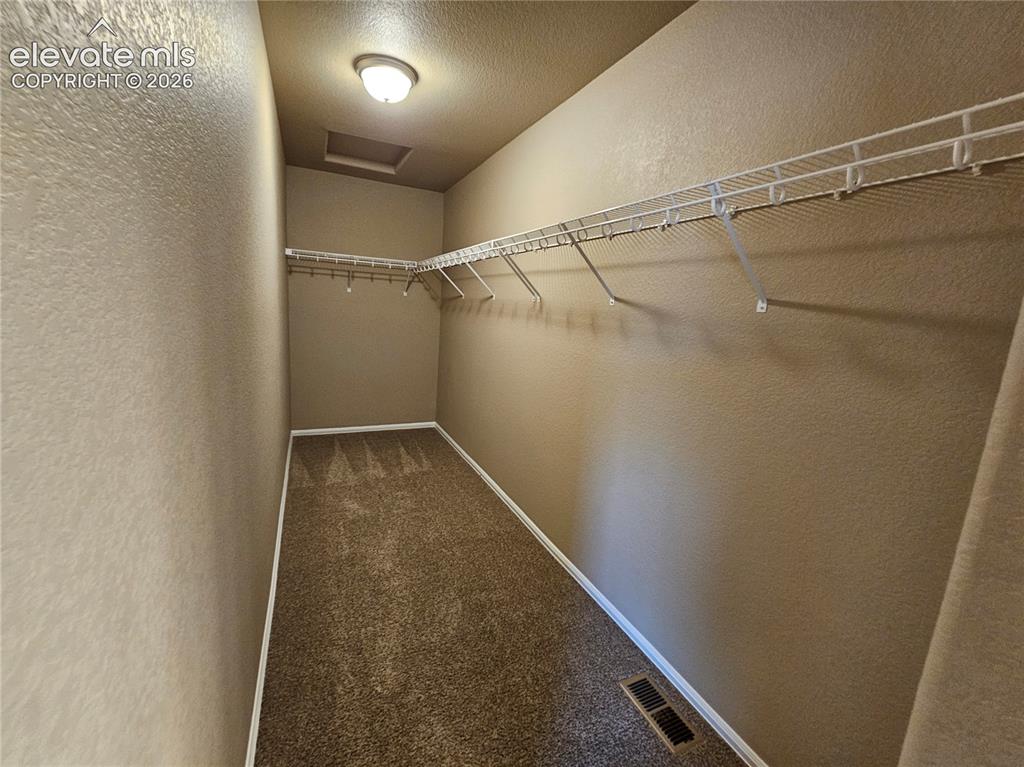 Image 12 of 20: Walk in closet
