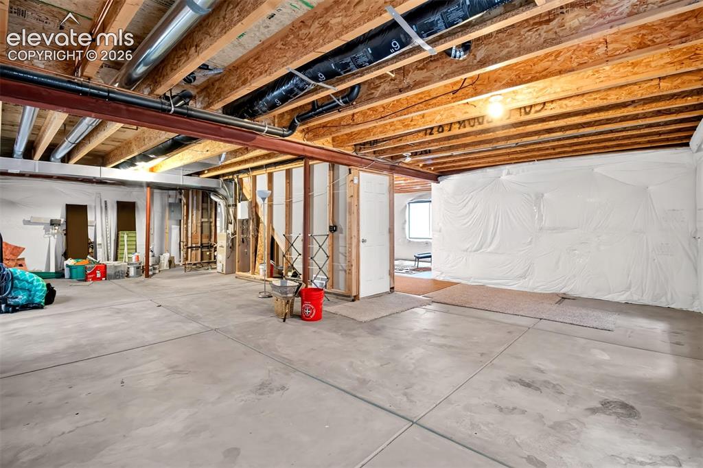 Image 22 of 35: Partially unfinished basement 