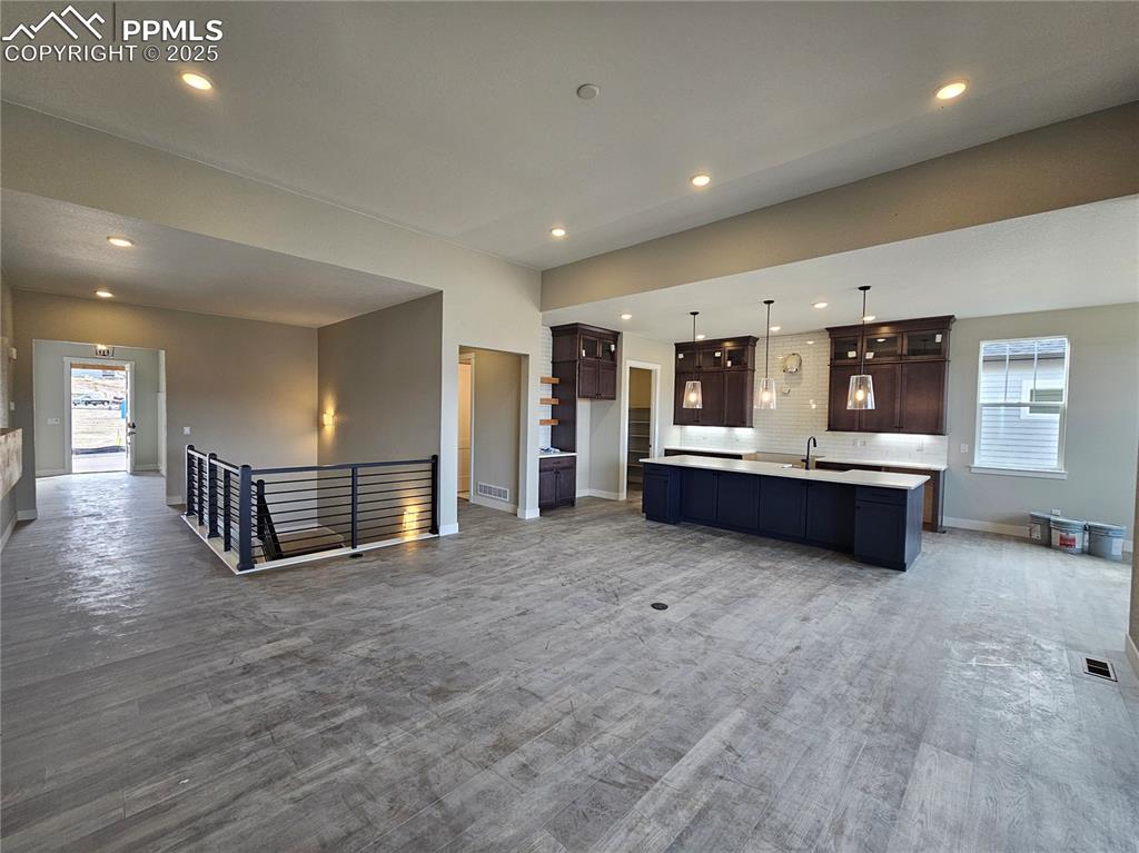 Image 7 of 20: Kitchen with healthy amount of natural light, open floor plan, tasteful bac