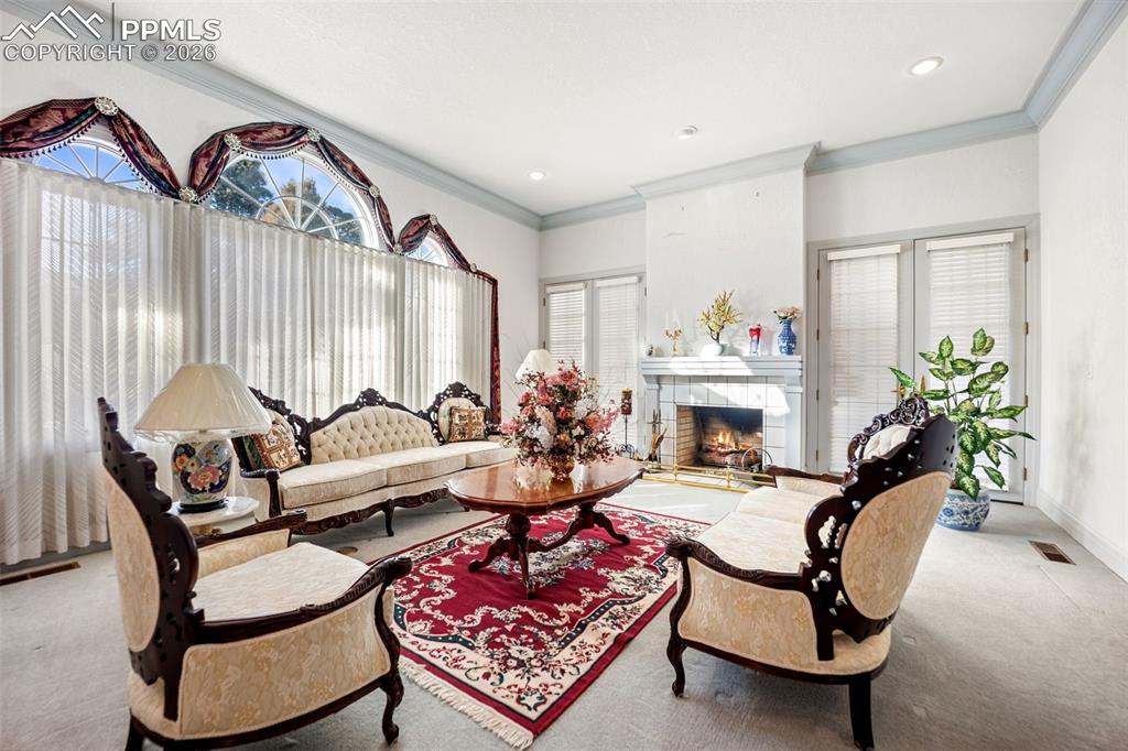 Image 6 of 50: Living Room with Walk out doors anf fireplace