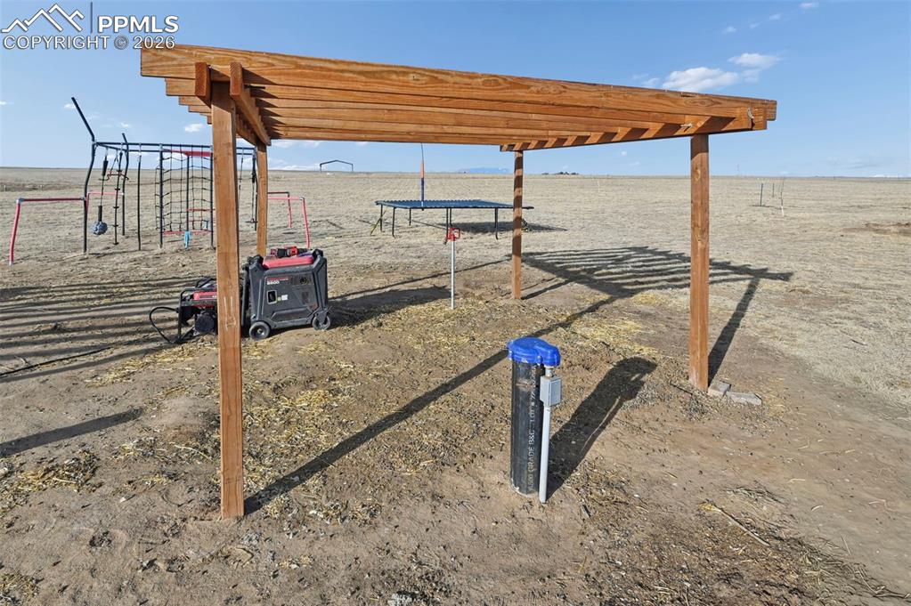 Image 21 of 31: well head and outdoor water spigot