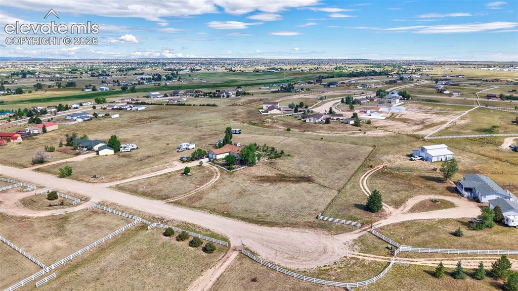 Image 33 of 38: Expansive rural landscape featuring scattered residences and open terrain