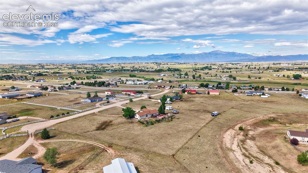 Image 5 of 38: Expansive rural landscape featuring scattered residences, vast open fields,