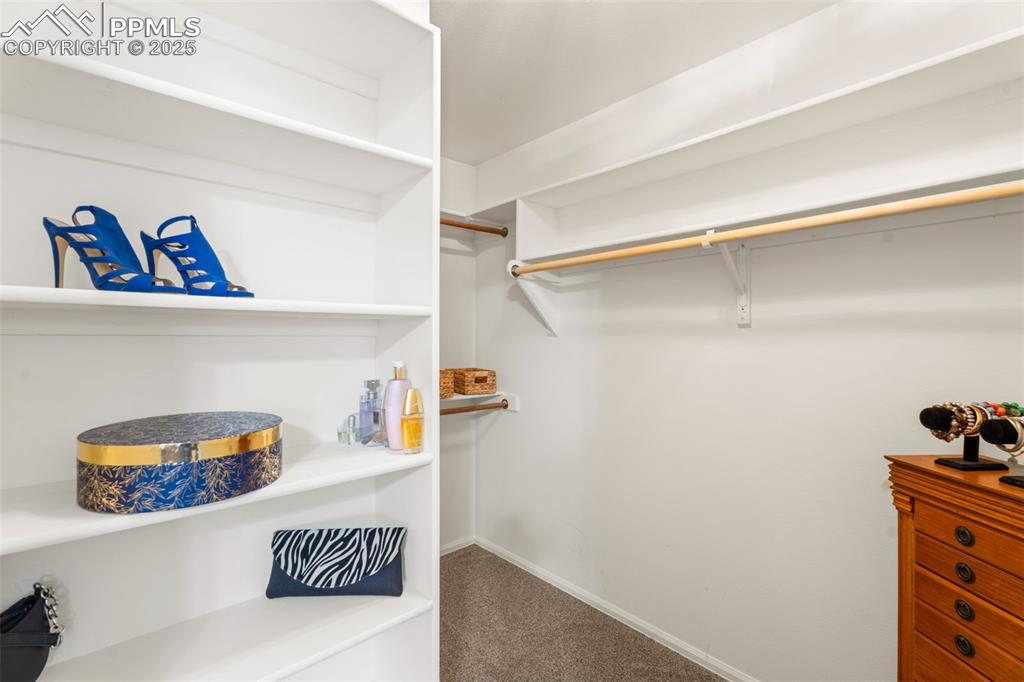 Image 16 of 32: Spacious primary bedroom walk-in closet,