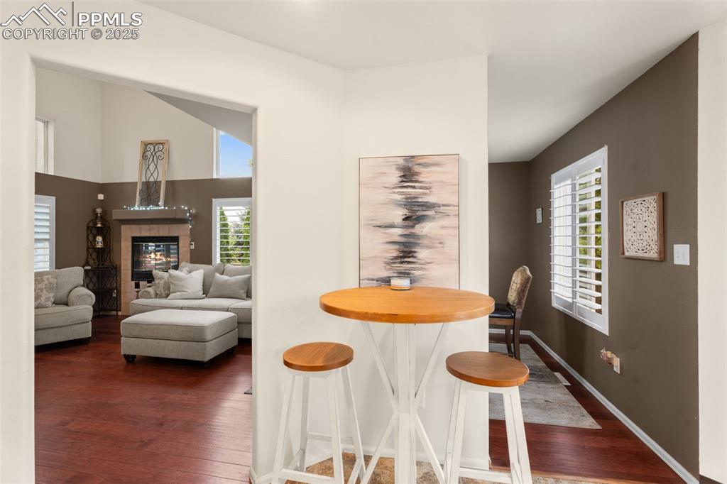 Image 7 of 32: Bright eat-in kitchen with views of the meticulously manicured backyard. Th