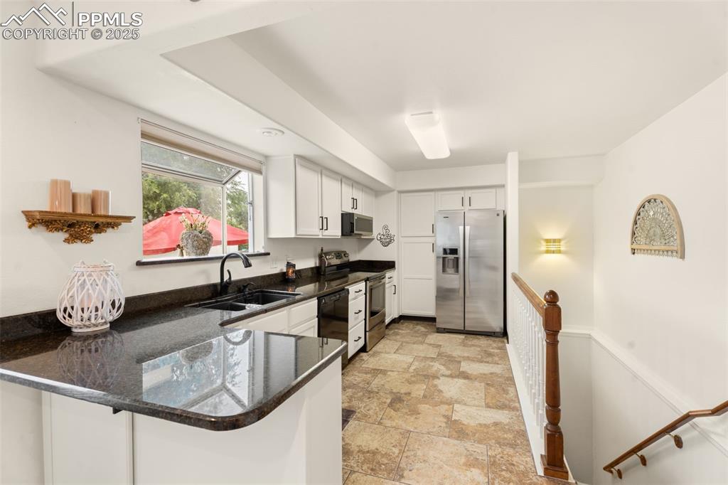 Image 8 of 32: Newly updated kitchen featuring granite countertops, a brand new perfectly