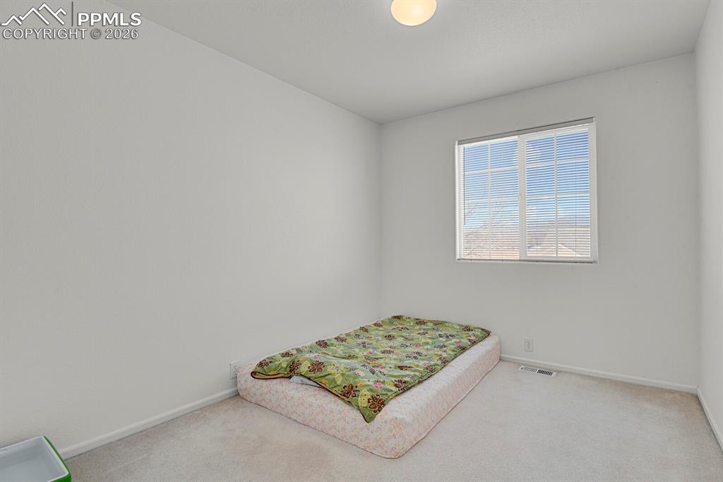 Image 23 of 38: Bedroom