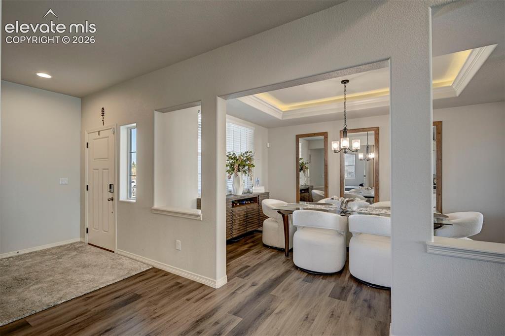 Image 4 of 45: Entryway with wood-finish flooring and a recessed architectural feature