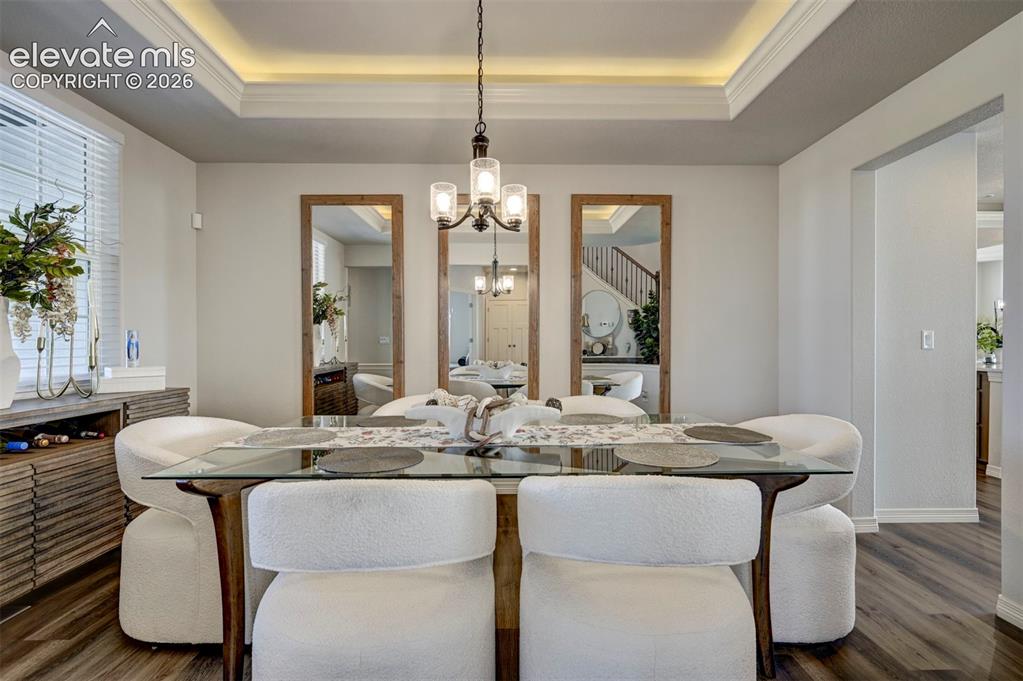 Image 5 of 45: Tray ceiling with recessed lighting and crown molding