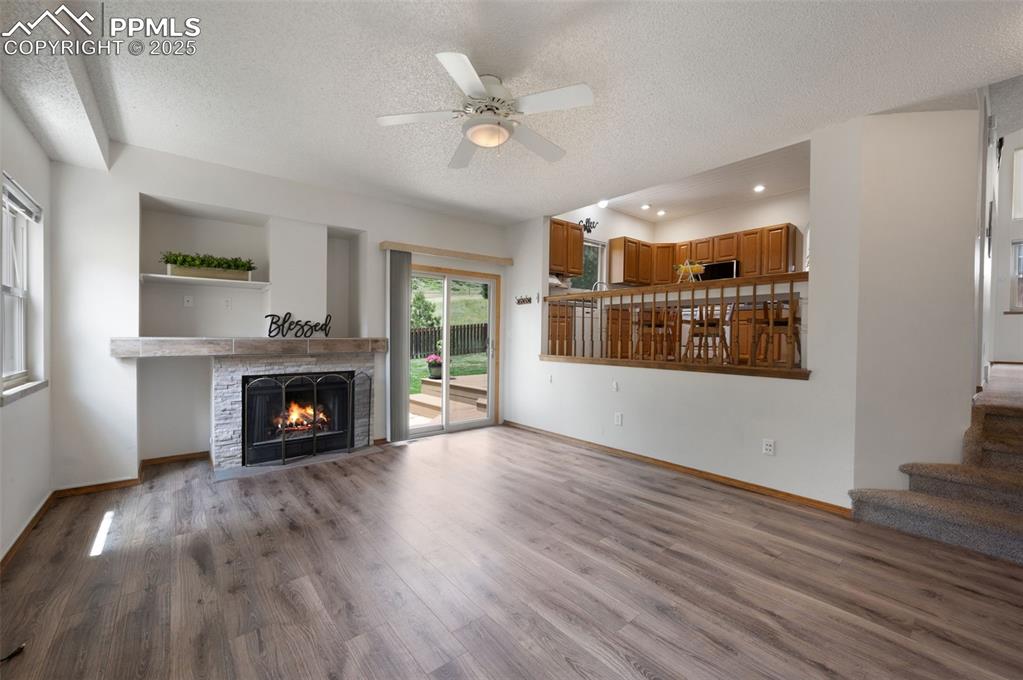 Image 13 of 50: LVP, gas fireplace