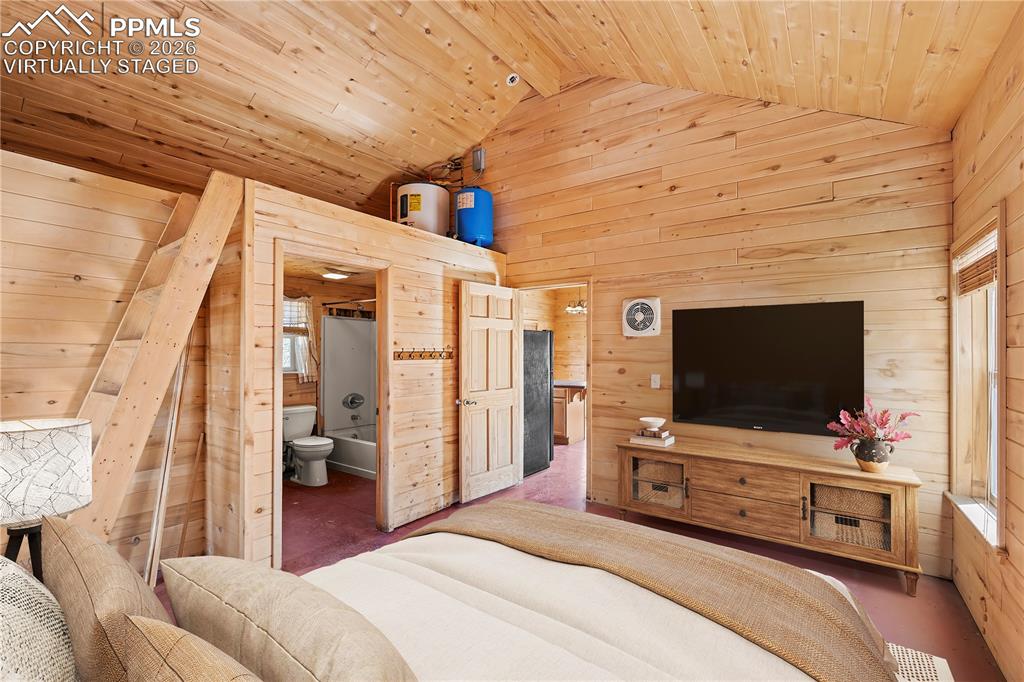 Image 3 of 10: VIRTUALLY STAGED - Bedroom, adjoining Bath and Loft Storage Area