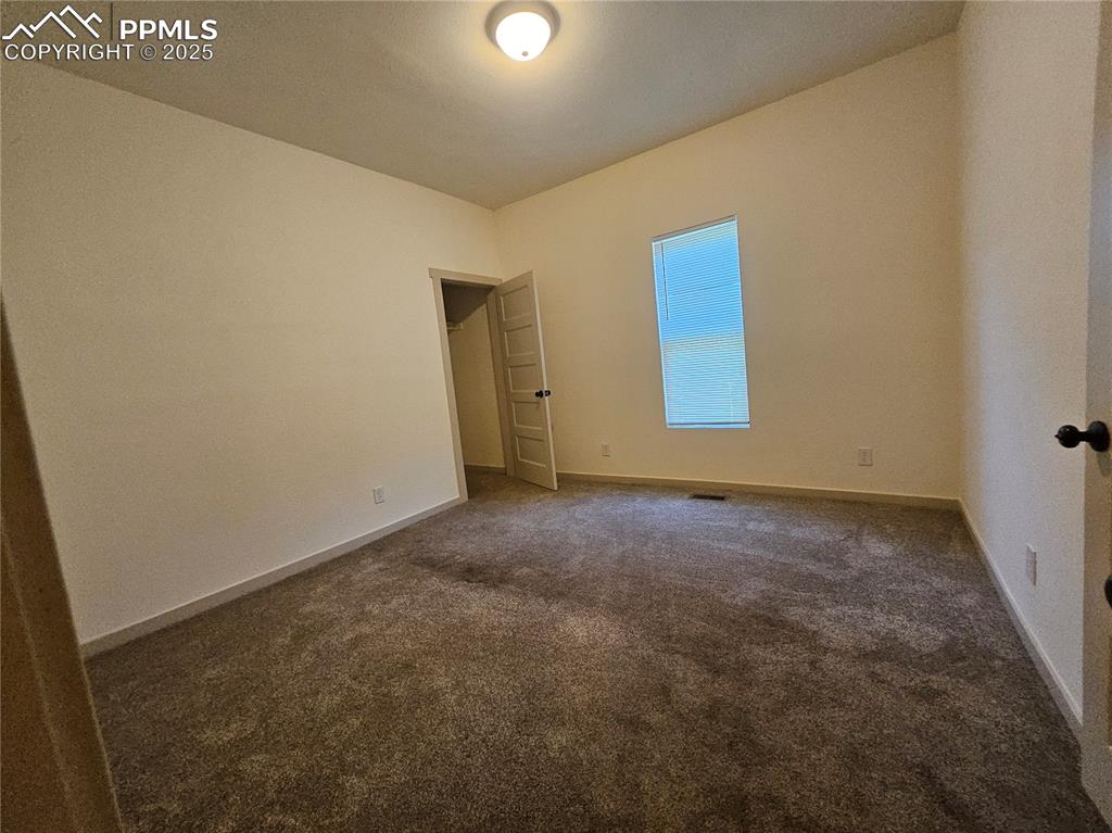 Image 9 of 23: Unfurnished room featuring carpet floors and baseboards
