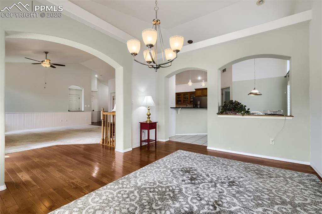 Image 11 of 31: Kitchen with solid quartz counters, stainless steel appliances, lofted ceil