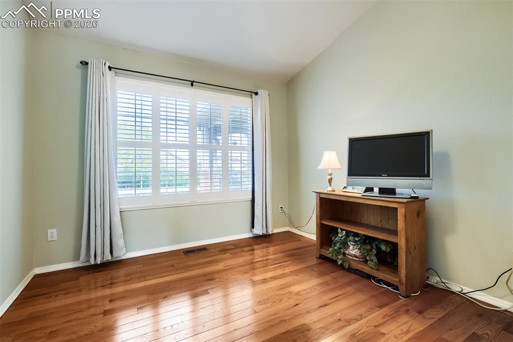 Image 17 of 31: Bathroom with double vanity, quartz countertops and tile flooring 