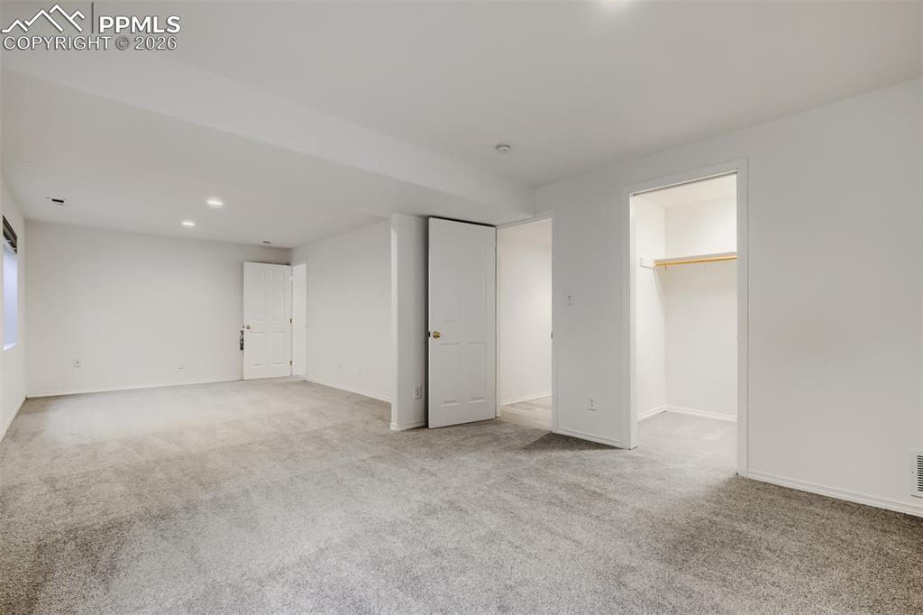 Image 24 of 31: The fully finished basement offers a spacious rec/family room with recessed