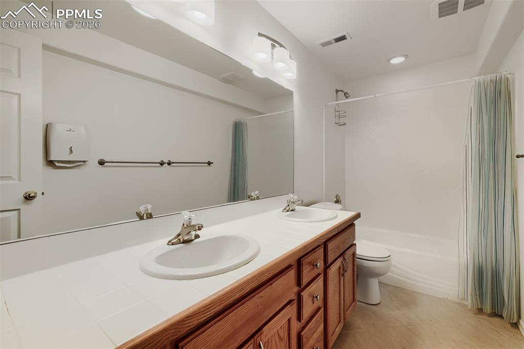 Image 25 of 31: Basement family room is perfect for game tables and a home theater 