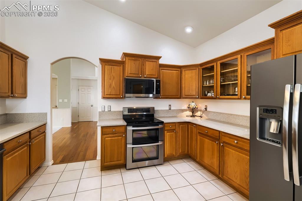 Image 8 of 31: Featuring gas fireplace, wainscoting and vaulted ceilings 