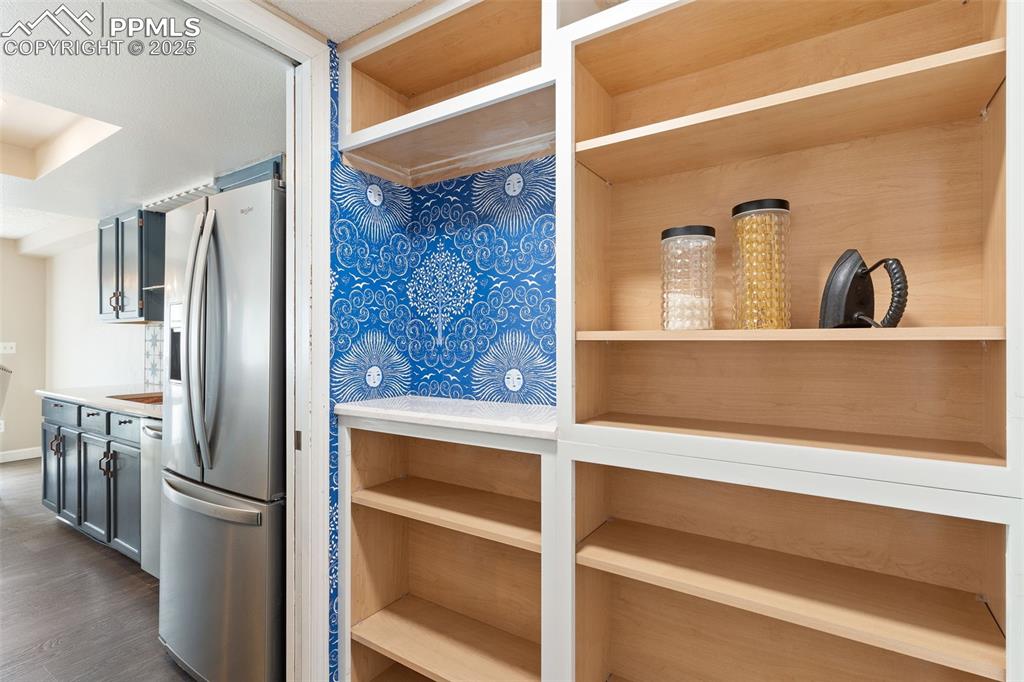 Image 17 of 34: Custom Butler Pantry with coffee bar and storage.