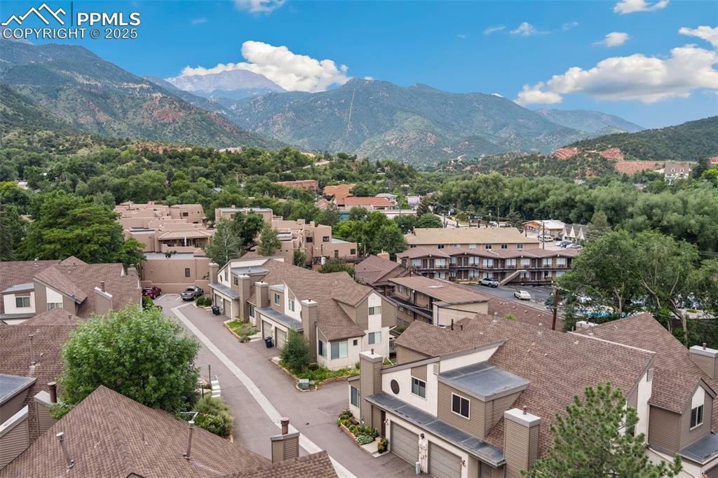Image 2 of 34: View of mountain background featuring nearby Pikes Peak and Garden of the G