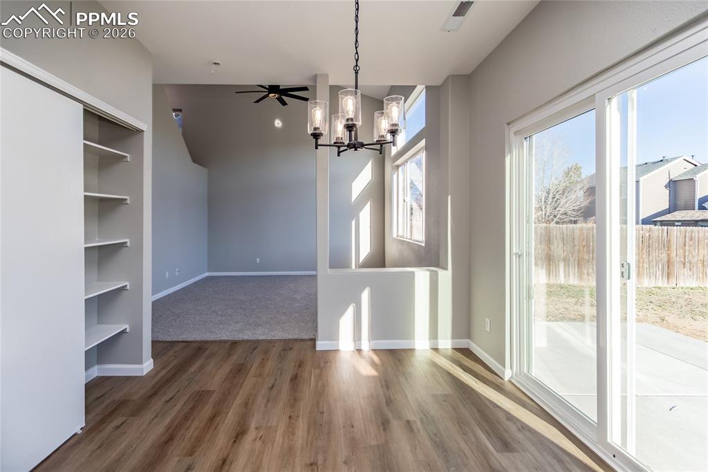 Image 18 of 42: View from the kitchen to the living room.