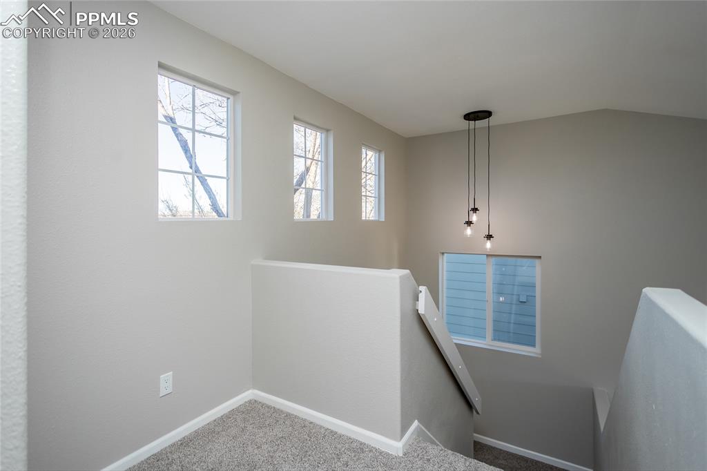 Image 22 of 42: The upstairs landing is even filled with light.