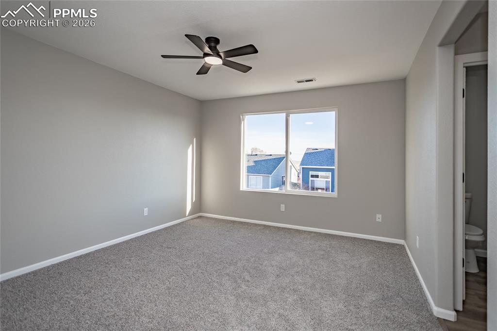 Image 30 of 42: The primary bedroom has an ensuite and walk-in closet, new paint, carpet, o