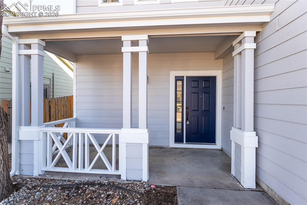 Image 4 of 42: Covered front porch welcomes your guests!