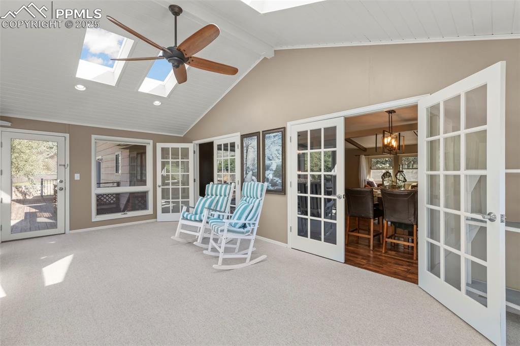 Image 19 of 46: Sunroom / solarium featuring a skylight and french doors