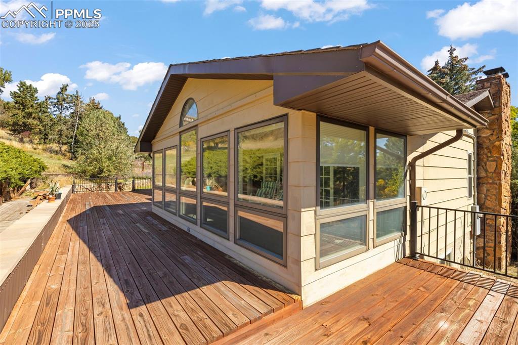 Image 39 of 46: Deck with a sunroom
