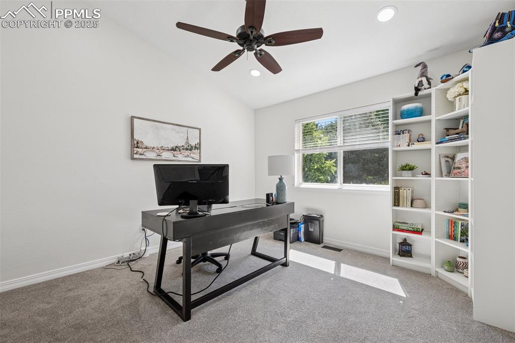 Image 31 of 50: Home office with carpet flooring, lofted ceiling, ceiling fan, and recessed
