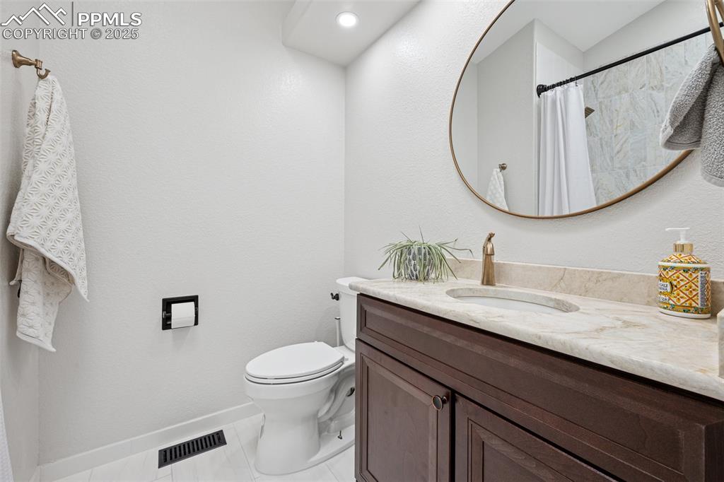 Image 34 of 50: Full bathroom featuring vanity and curtained shower