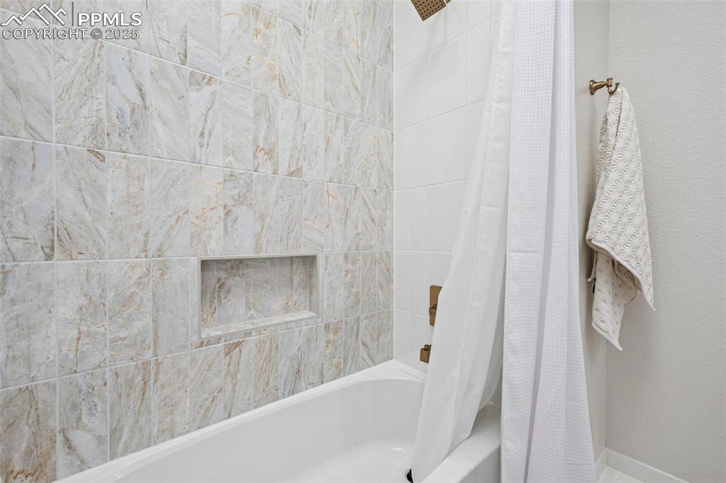 Image 35 of 50: Full bathroom featuring shower / bath combo