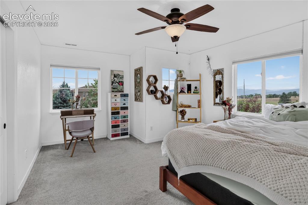 Image 16 of 26: Bedroom 3 w/ mountain view - upper level