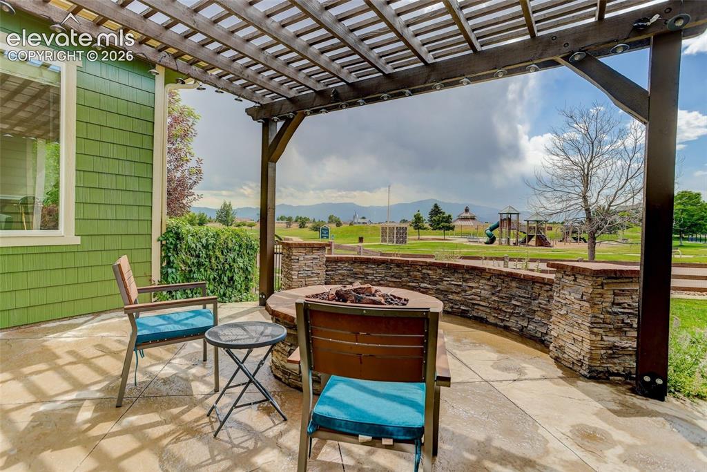 Image 24 of 26: Side patio w/ views of Pikes Peak & park