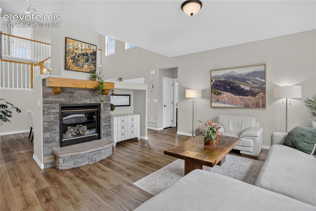 Image 5 of 26: Stone surround gas fireplace