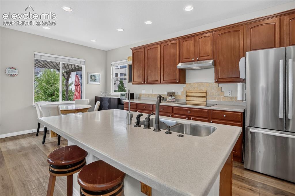 Image 7 of 26: Kitchen w/ dining nook