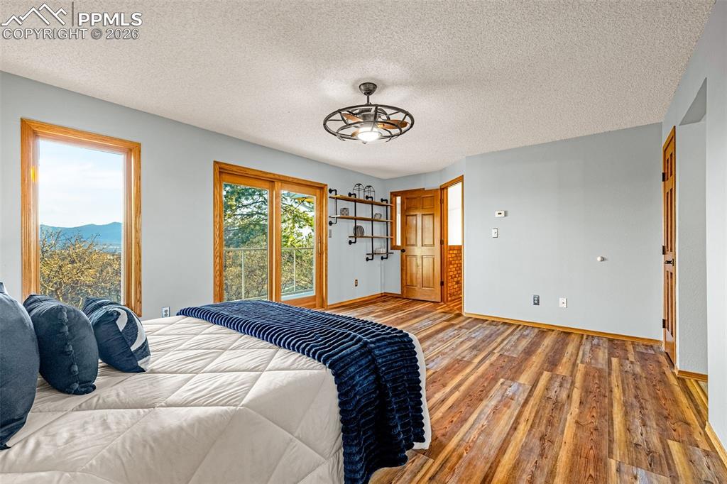 Image 22 of 39: Primary Bedrrom with ensuite bath and upper walkout balcony