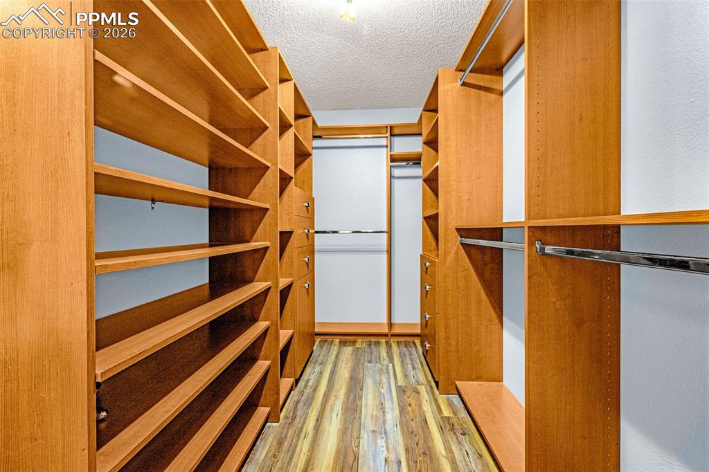 Image 26 of 39: Primary custom walk in closet