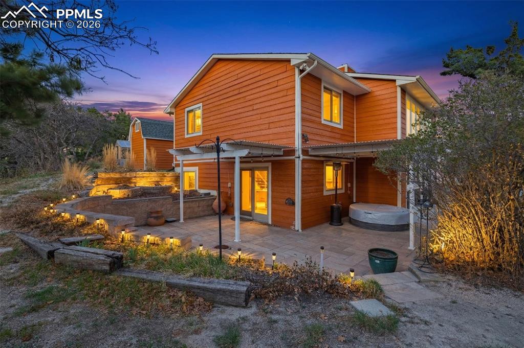 Image 39 of 39: Back patio, covered with Spa