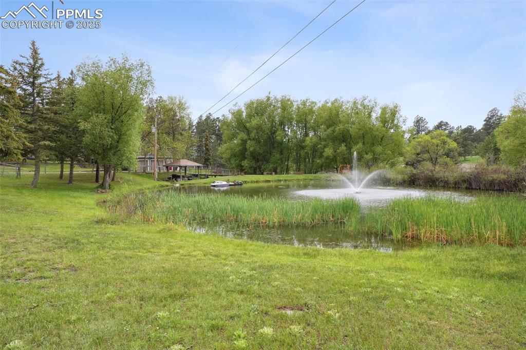 Image 2 of 38: View of yard with a water view