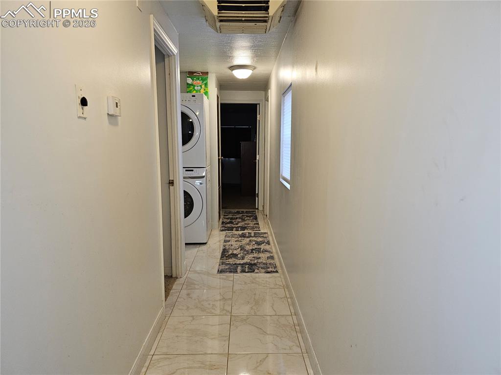 Image 13 of 28: Hallway and laundry