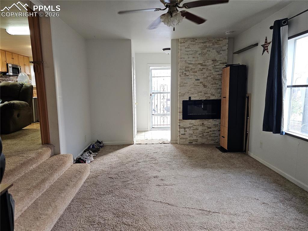 Image 3 of 28: Family room with fireplace