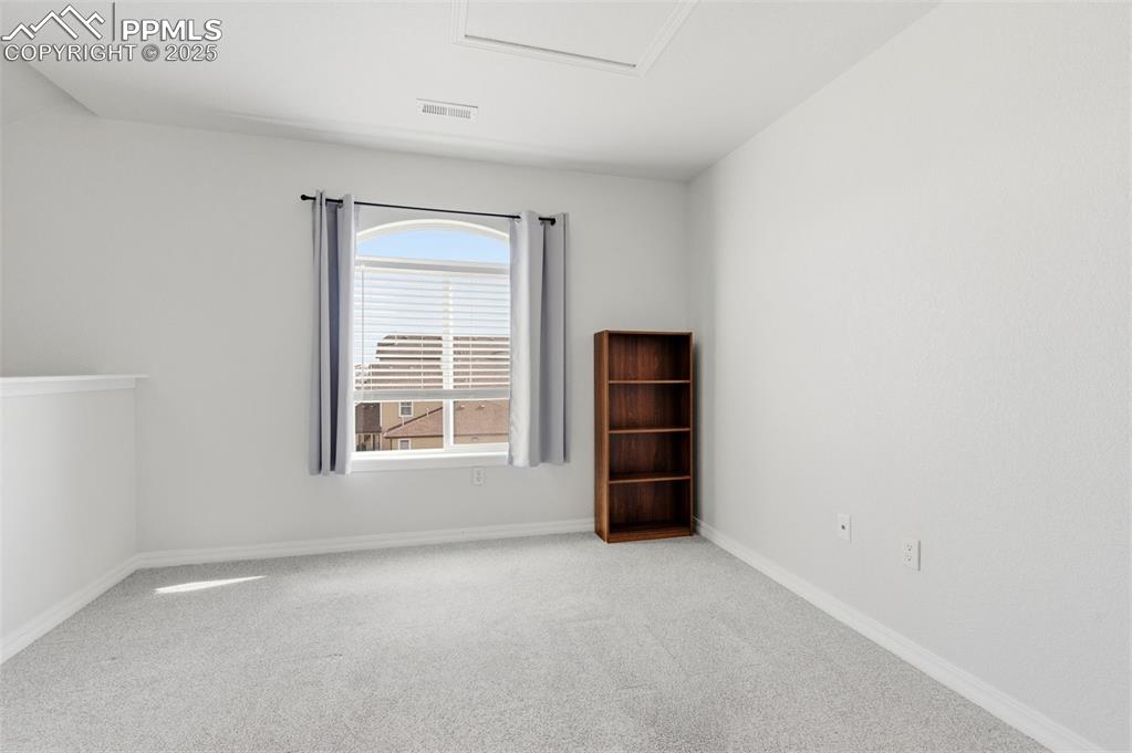 Image 33 of 39: Carpeted empty room featuring baseboards