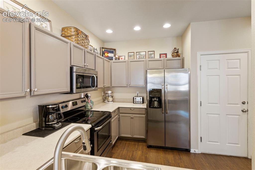 Image 11 of 26: View from living room shows dining area & kitchen.