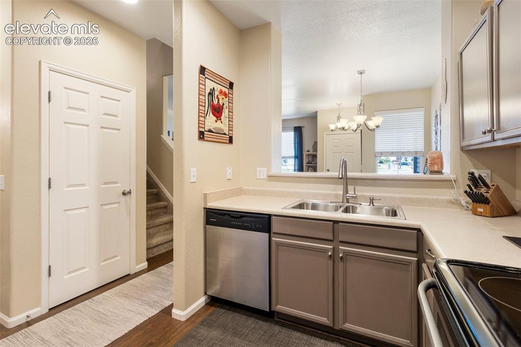 Image 12 of 26: The dining area comfortably accommodates a table for 6 AND additional seati