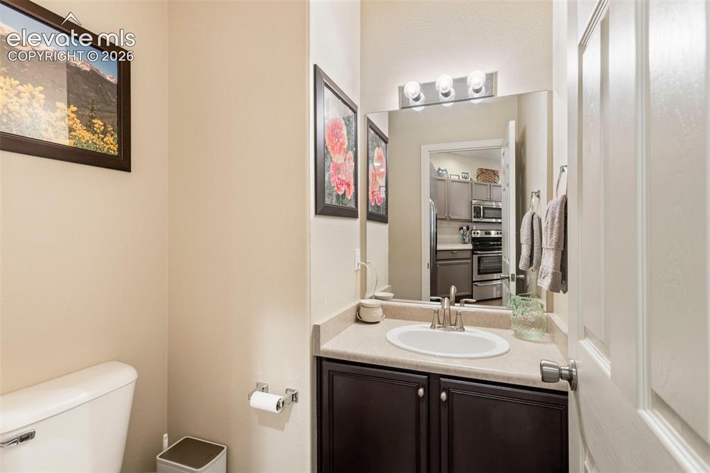 Image 13 of 26: The tastefully appointed kitchen boasts ample cupboards and countertops, SS