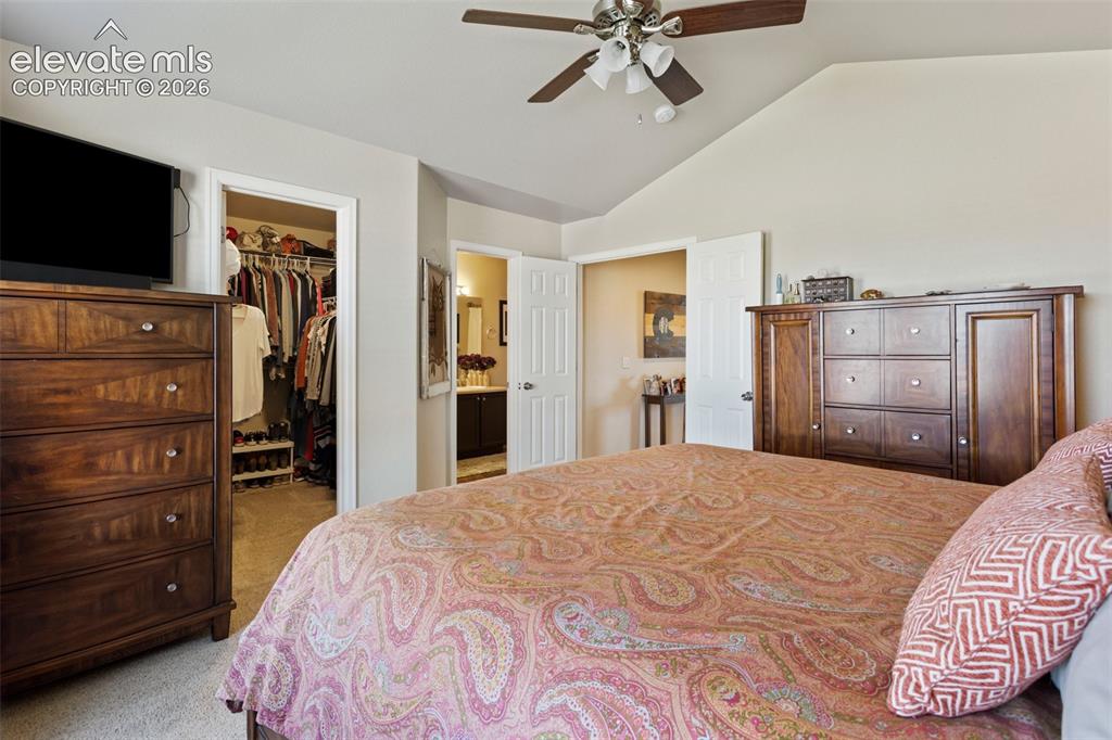 Image 15 of 26: The doorway across from kitchen is a storage area under the stairs with acc