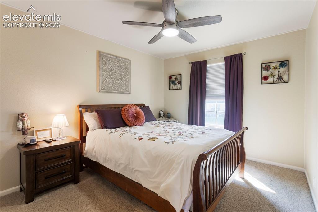 Image 17 of 26: The spacious upper level master suite is highlighted by a vaulted ceiling, 