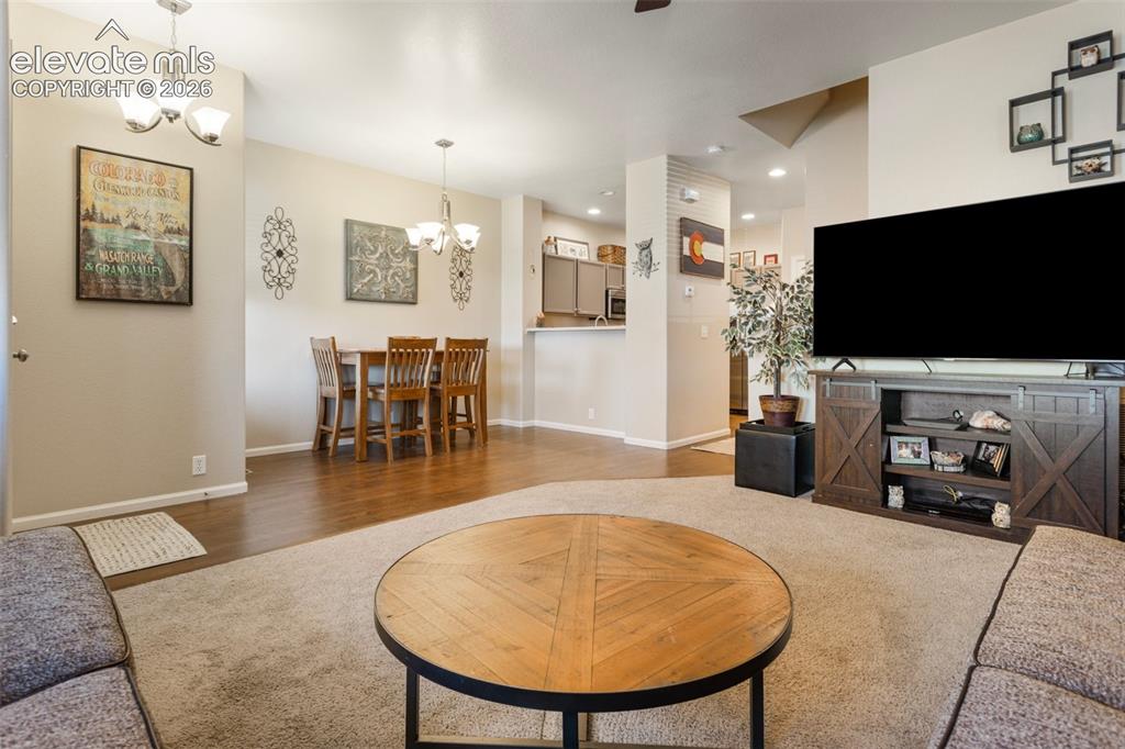 Image 8 of 26: Upon entry, you are greeted by the open living area. 